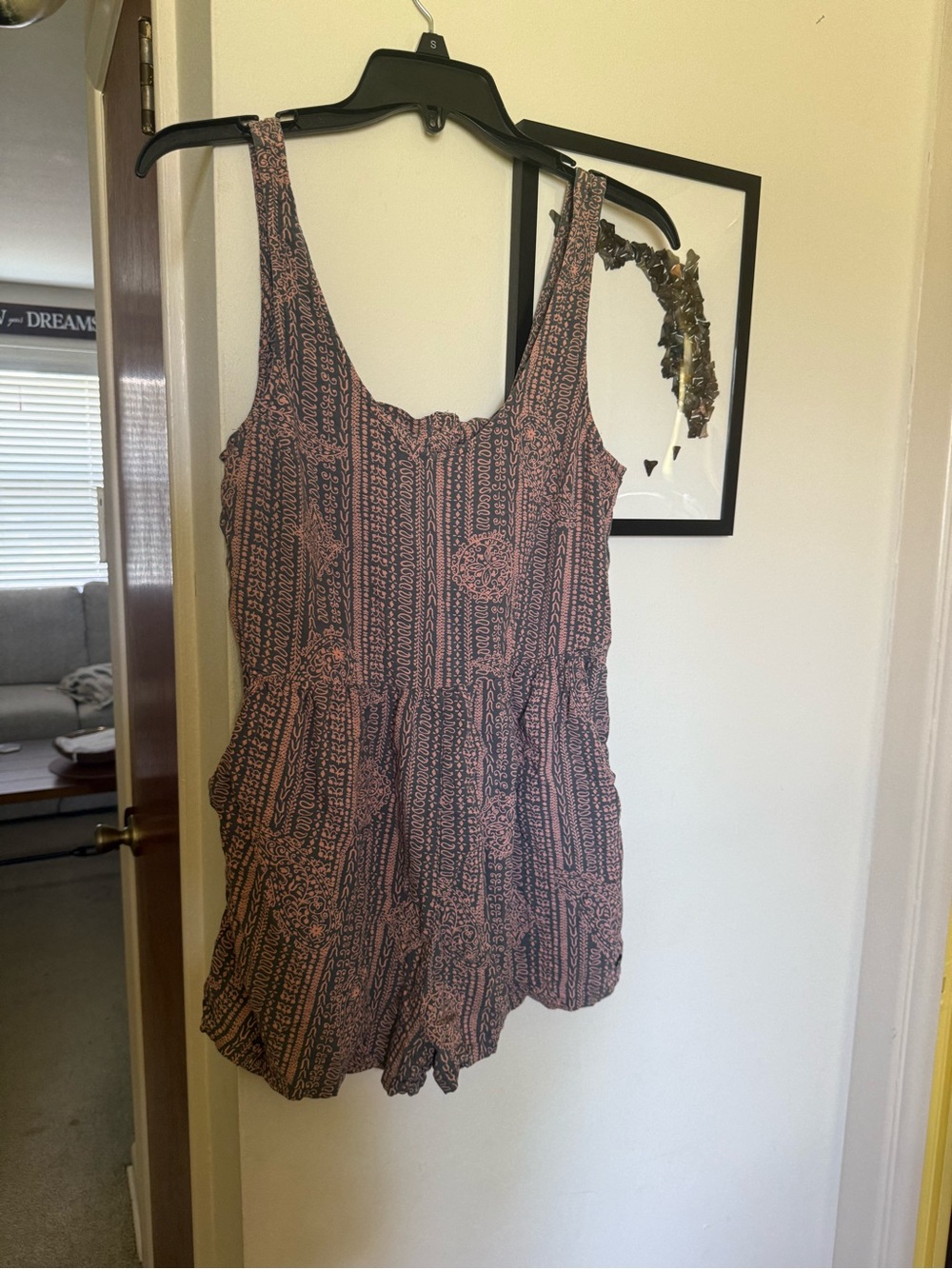 Roxy Love Bug romper featuring a pink and gray paisley pattern.